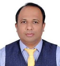 A person in a suit and tie
Description automatically generated with low confidence
